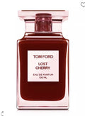 Tom Ford Lost Cherry Eau de Parfum 100ml bottle, featuring a dark cherry-red liquid inside a translucent pink glass bottle with a white label.