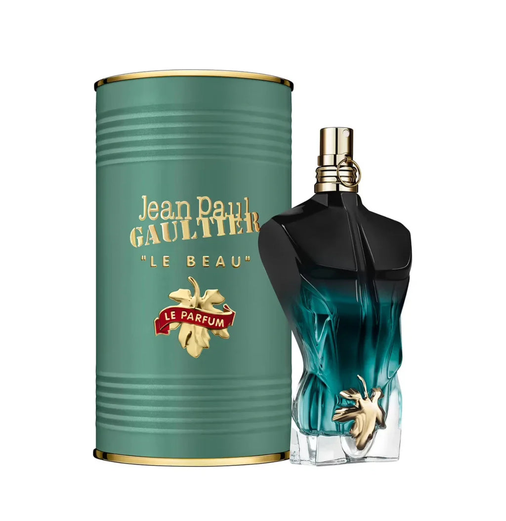 Jean Paul Gaultier Le Beau perfume bottle next to its signature green cylindrical packaging box with gold lettering, on a solid white background.