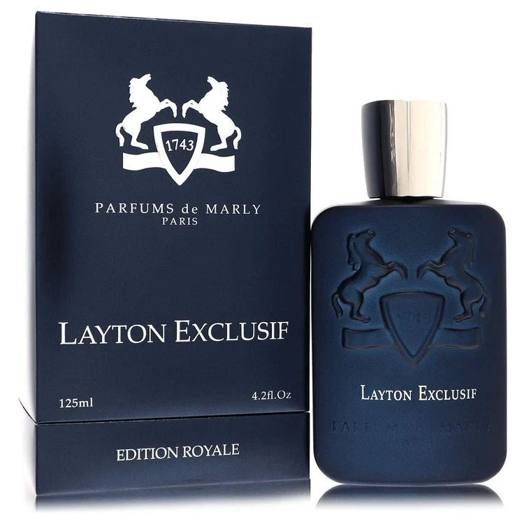 Layton Exclusif Eau de Parfum bottle and its packaging box by Parfums de Marly Paris. The bottle and box are dark navy blue with a silver metallic cap and embossed/printed white logos and text.