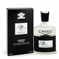 Creed Aventus Eau de Parfum 100ml bottle next to its black packaging box, featuring the iconic Aventus horse logo and black and white label design.