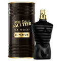 Jean Paul Gaultier Le Male Le Parfum fragrance shown with a black cylindrical box and a black bottle shaped like a male torso, both with gold lettering and trim, on a white background.