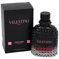 Valentino Uomo Born in Roma Intense Eau de Parfum Intense, featuring a textured black glass bottle with a red gradient at the bottom and its black packaging box with pink lettering.