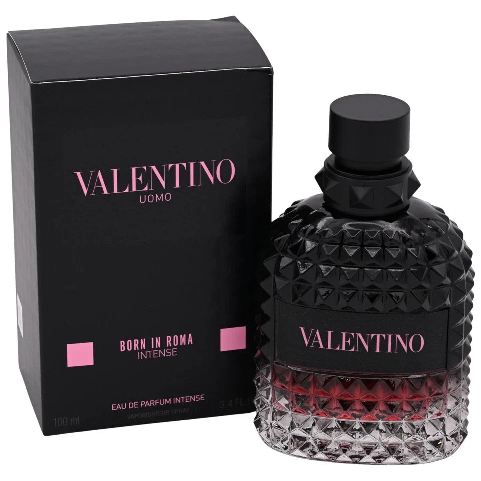 Valentino Uomo Born in Roma Intense Eau de Parfum Intense, featuring a textured black glass bottle with a red gradient at the bottom and its black packaging box with pink lettering.